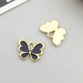 Cute black enamel butterfly alloy charm showing golden textured back and front view - Black Enamel Butterfly Style (11865)
