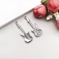 Detail view of two antique silver electric guitar pendants for DIY jewelry making - Antique Silver Musical Guitar 12*38mm (4841)