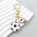 Colorful football keychain with soccer ball and red shoe pendants in gold finish - Football Shoes Style (ER772)