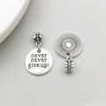 Antique silver charm with 'never never give up!' engraving and sunburst texture - Inspirational Tag NEVER GIVE UP (18387)