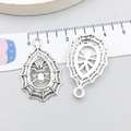 Detail view of silver spider web pendants with scale ruler showing 3cm size for DIY jewelry - 21*34mm / Antique Silver Hollow Spider (2999)