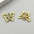 Pair of antique gold butterfly pendants with intricate cutout design for DIY jewelry - Antique Gold Hollow Butterfly (11086)