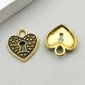Antique gold heart-shaped lock pendant with granular texture and hollow back detail - Antique Gold Heart Lock (11087)