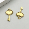 Set of two vintage gold alloy heart-shaped key pendants with beaded edge details - Antique Gold Heart Key (11091)