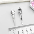 Macro detail of bird skull pendants in silver alloy with 4.5cm ruler for size scale - Antique Silver Bird Skull Head (15551)