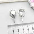 Macro detail of antique silver bird skull pendants with ruler showing 2.6cm length - Antique Silver Bird Skull Head (15552)
