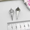 Detail showing front and back of antique silver bird skull pendant with baroque patterns - Antique Silver Bird Skull Head (15553)