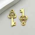 Pair of antique gold alloy vintage key pendants with hollow patterns for DIY jewelry - Antique Gold Hollow Key (11117)