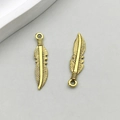 Antique gold feather-shaped alloy pendant with detailed textures for DIY jewelry making - Antique Gold Feather (11118)