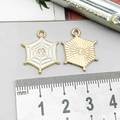 Detail of 20mm hexagonal spider web enamel charms showing front and back metal textures - White Enamel Spider Web (14008)