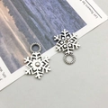 Antique silver snowflake charms for DIY jewelry making with intricate metal details - Christmas Snowflake (8388)
