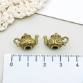 Macro detail of antique bronze teapot charms with floral relief and ume engraving - Antique Bronze Teapot (97)