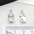 Macro shot of antique silver clock charm detail with measurement scale on white background - Small Alarm Clock Gear Pendant (2943)