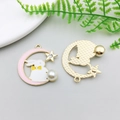 Detail of Easter bunny moon pendants with enamel finish and imitation pearls for jewelry - 30x33mm / Pink Enamel Moon White Bunny Style
