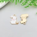 Detail of bunny charms with enamel finish, pink bow, and pearl tail for DIY jewelry - 16x17mm / White Enamel Beaded Rabbit Style