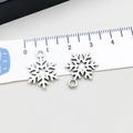 Silver snowflake alloy pendant for DIY jewelry making, 2cm size shown with scale - Christmas Snowflake (13884) / 14*18mm