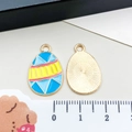 Colorful Easter egg pendant with geometric drip oil pattern and gold metal texture - Blue Yellow Chick Egg (15140)