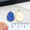 Blue Easter egg charm with colorful polka dots and golden sunburst textured back - Royal Blue Polka Dot Egg (15144)