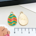Colorful Easter egg enamel alloy pendant with golden sunburst texture back and ring - Green Yellow Wavy Egg (15146)