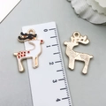 Detail of Christmas elk pendant with white enamel finish and golden textured metal back - Red White Rhinestone Christmas Elk (8864)