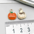 Halloween pumpkin jack-o-lantern alloy charm in orange and gold finish with size ruler - Orange Enamel Pumpkin Charm (14010)
