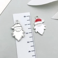 Detail of Christmas Santa pendants showing 2.5cm size scale and red drip oil process - White Enamel Santa Claus-19659