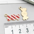 Red and white striped candy charm pendant in gold-tone alloy for DIY jewelry - Red and White Enamel Candy (14018)