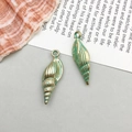 Vintage green and gold shell pendants with detailed spiral texture for DIY jewelry - 1 Piece (8x22mm)