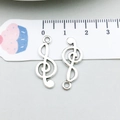 Macro view of antique silver musical note charms with connectors for DIY jewelry making - Antique Silver Music Symbol (5619) / 10*25mm