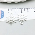 Detailed view of silver snowflake charms with measuring ruler showing 2cm size - Christmas Snowflake Style (20021)