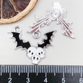 Halloween bat wing pendant with three white skulls in black enamel and alloy finish - Black Enamel Bat Skull