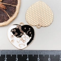 Heart-shaped black and white enamel cat pendant with golden metal outline and bail - Black Heart Cat (19382)
