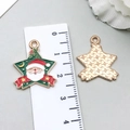 Star-shaped Christmas pendant featuring Santa Claus and holly leaf design in enamel finish - Green Santa Claus (19690)