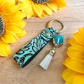 Porte-clés de style western en cuir avec gaufrage floral et pompon blanc élégant - Style Gland Gaufré Feuille Vintage (5)
