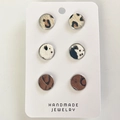 Detailed close-up of handmade round leather stud earrings featuring leopard and cow prints - Leopard/Cow/Brown Texture Style (7)