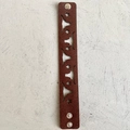 Detail of dark brown leather bracelet featuring hollowed-out star and longhorn patterns - Bull Head Star Hollow Style (4)