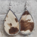 Macro detail of teardrop earrings featuring brown spotted horsehair and silver textured edges - Brown White Spotted Texture (4)