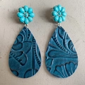 Close-up of bohemian leather earrings with turquoise flower and western embossed pattern - Blue Vintage Floral Style (2)