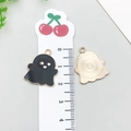 Ghost charm for DIY jewelry with black enamel finish and gold back, shown with ruler - Halloween Ghost (15129)