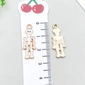 Golden skull pendants with white enamel finish and size reference for DIY jewelry making - Halloween Skeleton (15135)
