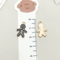 Gingerbread man enamel charm pendant with golden trim and measurement scale detail - Black Christmas Snowman Cookie (17518)