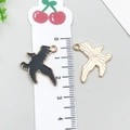 Bird-shaped black enamel and gold alloy charms with scale bar showing 2cm height - Halloween Crow (19543)