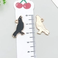 Enamel black bird charm for DIY jewelry with golden back and detailed wings - Halloween Crow (19546)