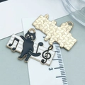Detail of black cat and musical note charm showing the textured gold metal back - Black Cat With Musical Note (18550)