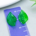 Translucent green leaf resin pendant with veins shown on a ruler for scale - Green Small Irregular Leaf Style