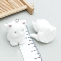 White flocked cat charms with metal rings for DIY jewelry making and handmade crafts - White Resin Flocked Sitting Puppy with Upward Tail (24802)