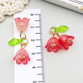 Detail of lily of the valley earrings in pink resin with ruler showing 3.5cm size - Transparent Red (23261)