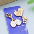 White enamel badminton racquet charms in gold finish for DIY jewelry crafting - White Double Badminton Rackets / 20*12mm