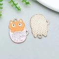 Cartoon orange cat in pink coffee cup alloy charm with golden edges and grid texture - Orange Cat in Pink Tea Cup