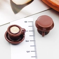 Macro shot of 3D miniature resin coffee cup charms with latte art for DIY jewelry - Brown 3D Latte Art